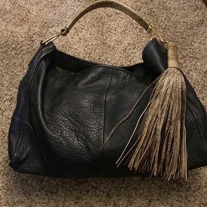 G.I.L.I. Leather slouchy handbag with tassel